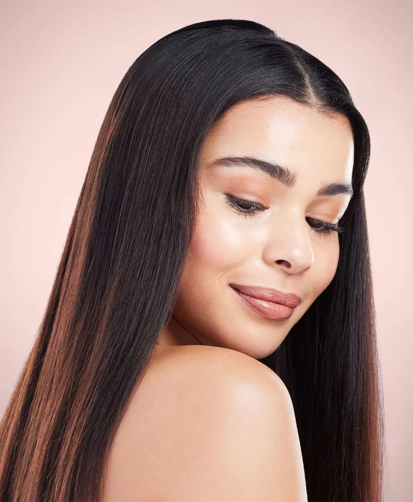 Woman with long, healthy hair after combination hair therapy
